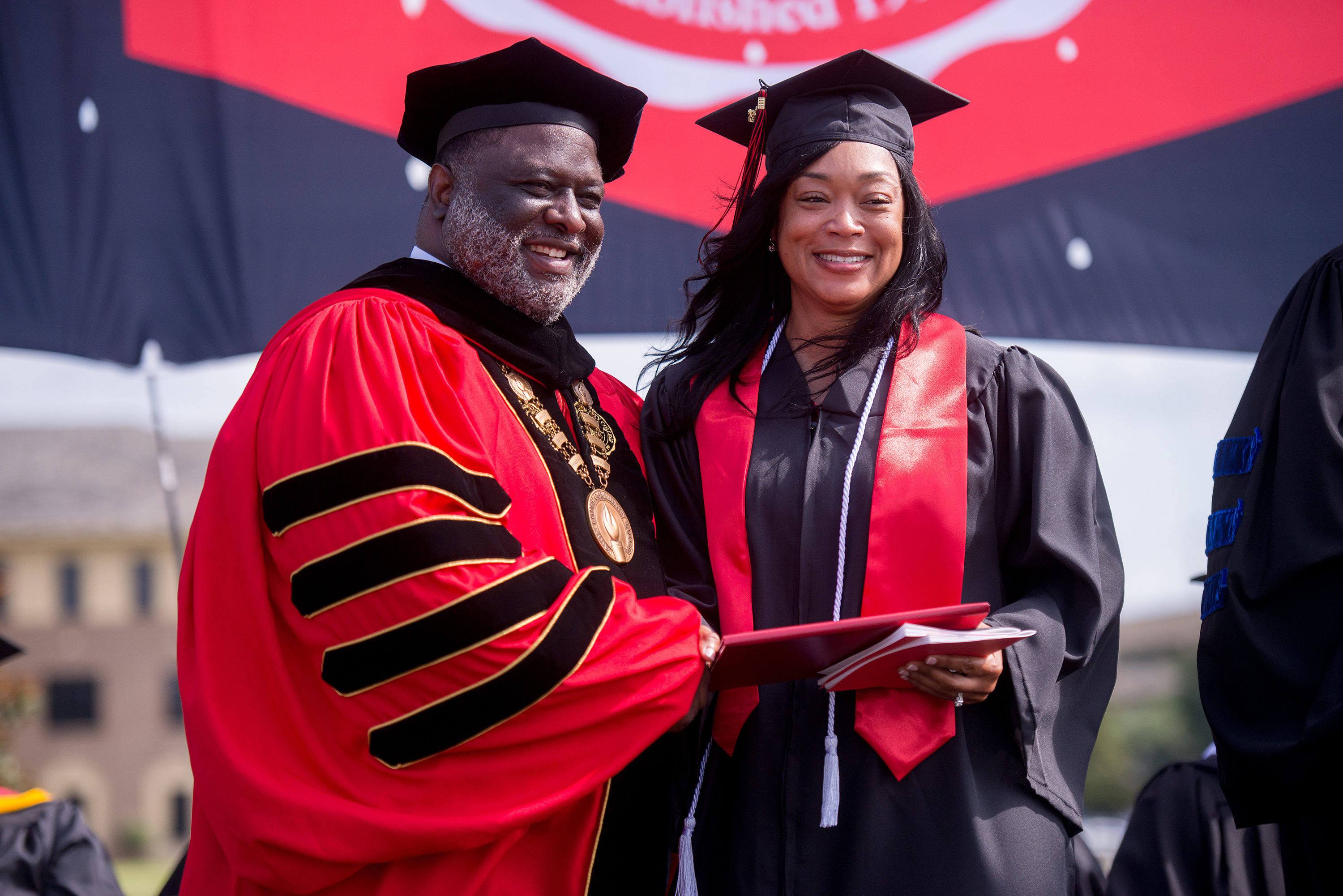 Caption: Baton Rouge Community College Chancellor Dr. Willie E. Smith congratulates a graduate during BRCC’s 26th commencement ceremony held on Friday, May 20. 