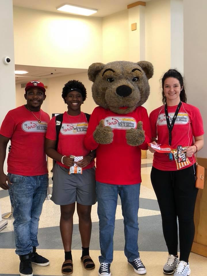 Maxwell the Bear mascot and students in Write Path T-shirts